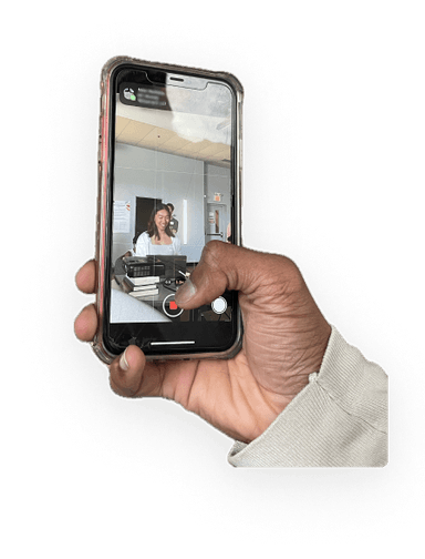 hand holding phone taking a video of a demo